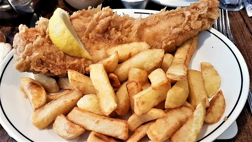 Fish and chips with a lemon wedge